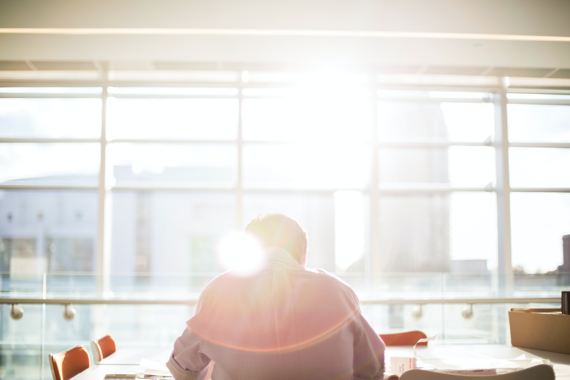 Man in front of sunlit window